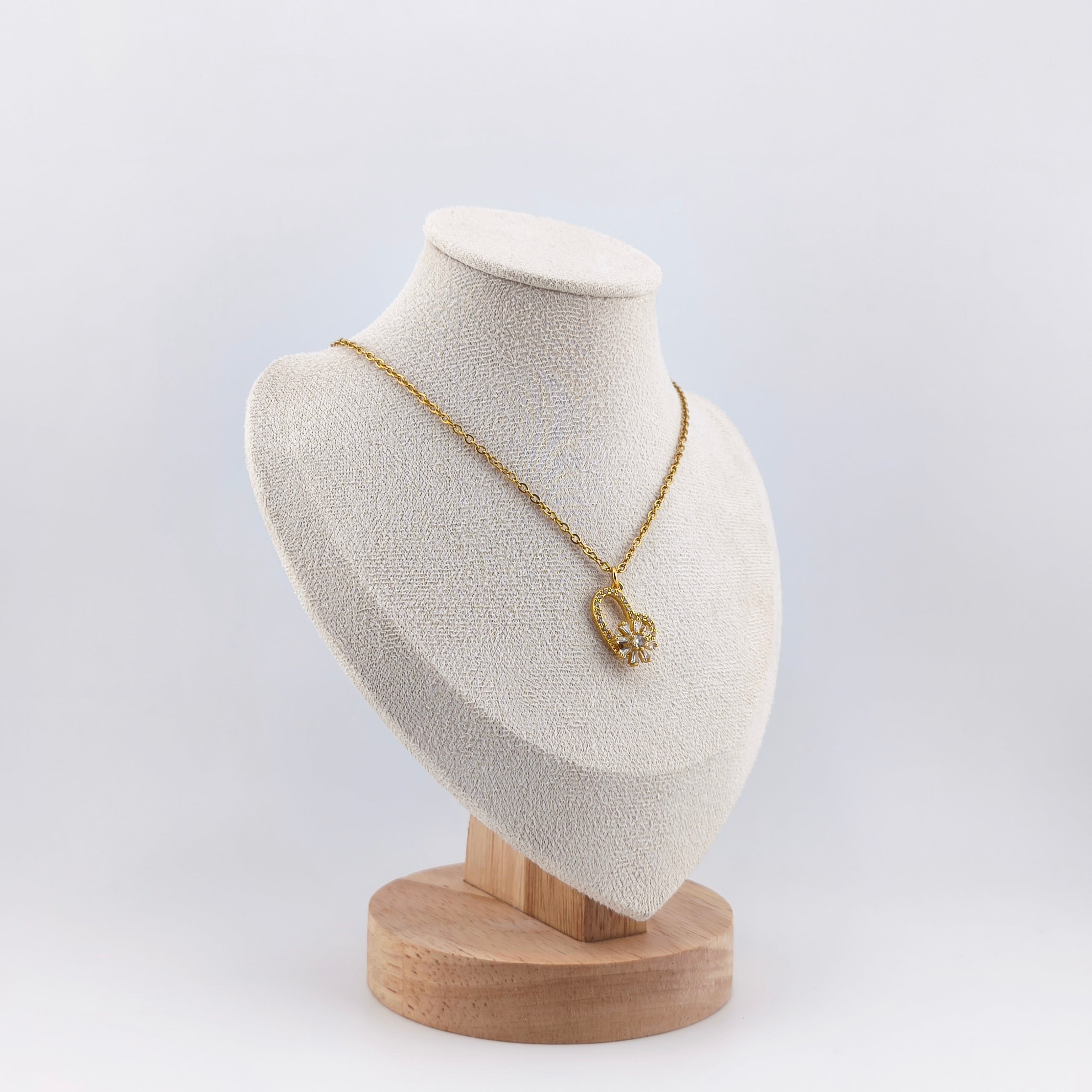 Gold-tone wire, openwork heart pendant with rotating flower set with cubic zirconia | Hearts Collection – Amor Jewelry 