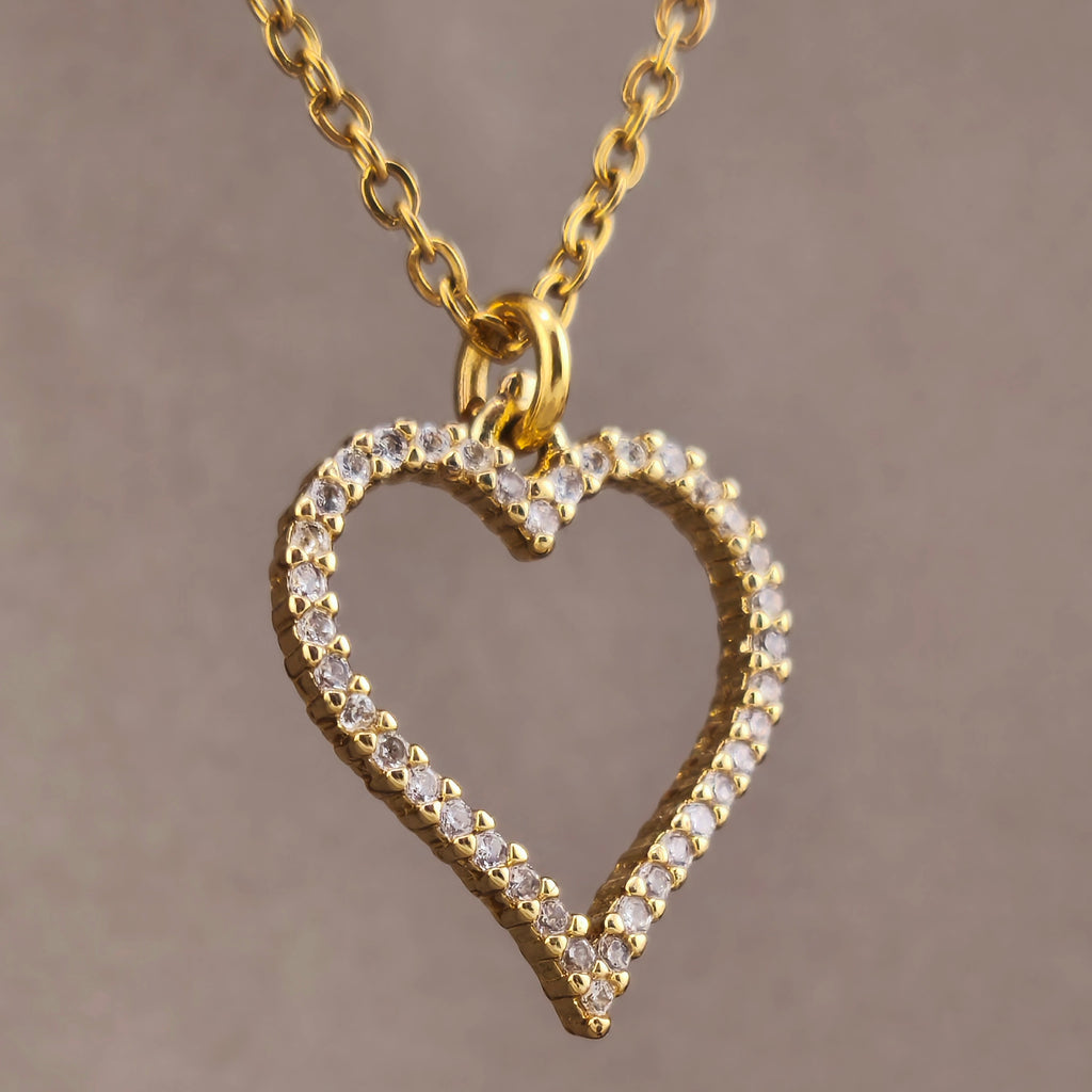 Gold-tone chain with openwork heart-shaped pendant surrounded by cubic zirconia | Hearts Collection – Amor Jewelry 