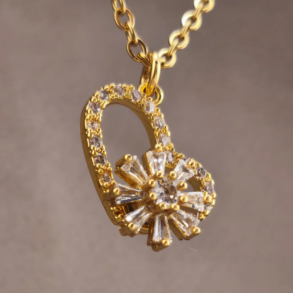 Gold-tone wire, openwork heart pendant with rotating flower set with cubic zirconia | Hearts Collection – Amor Jewelry 