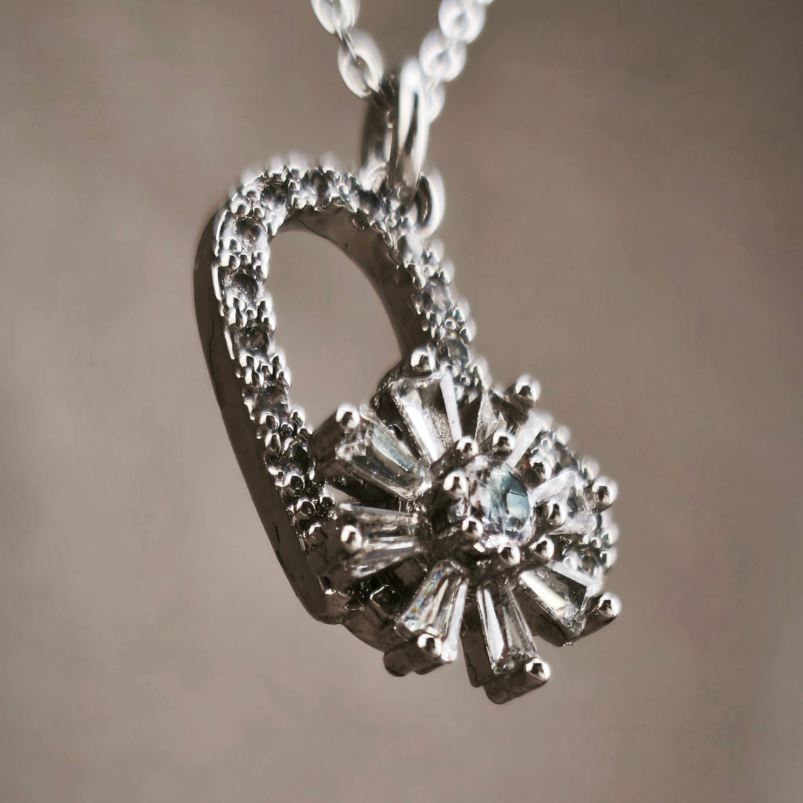 Gold-tone wire, openwork heart pendant with rotating flower set with cubic zirconia | Hearts Collection – Amor Jewelry 