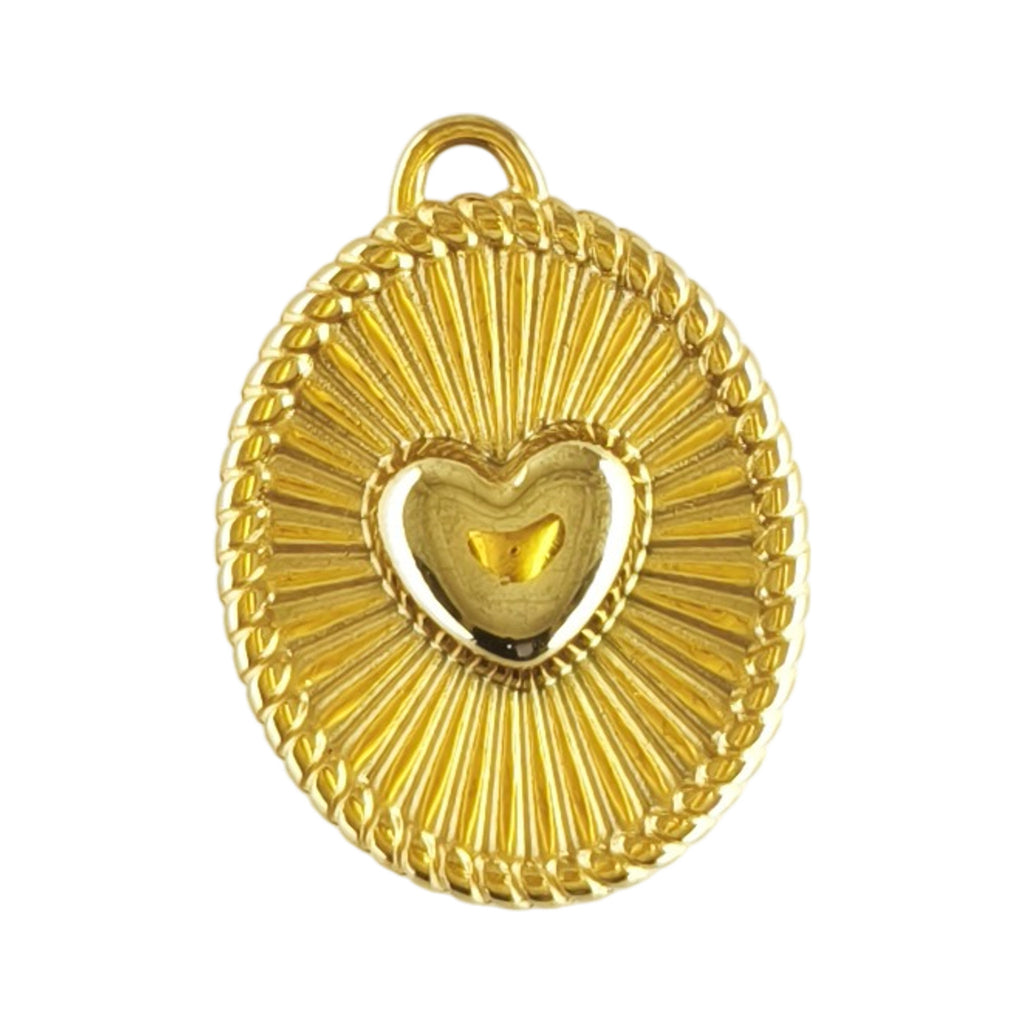 Pendente Compasso do Amor dourado em aço inoxidável, visto de frente, com coração central e desenho radial, sobre fundo branco.