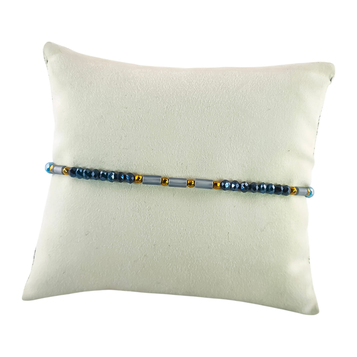 Pulseira Cintilante Reflexo em azul-cerúleo · azul-noite · branco, apresentada em expositor